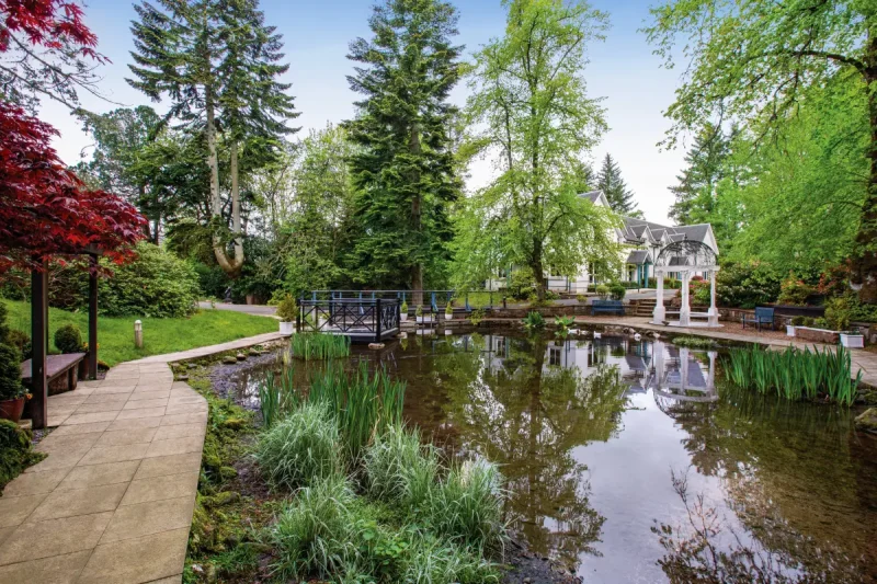 Duchally Country Estate green exterior and pond